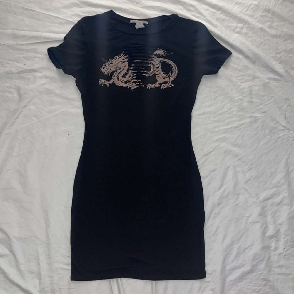 Black dress, just a little above the knee, also tight fit. SMALL could fit M.